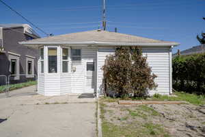 View of front of property with roof with shingles