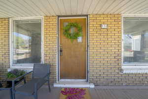 Property entrance with brick siding