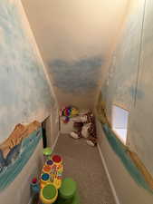 Playroom with baseboards and carpet flooring