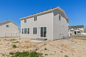 Rear view of property with a patio area and large backyard