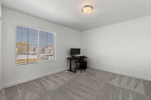 Second floor spare bedroom with large window and walk-in closet