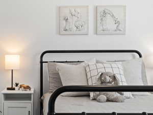 Bedroom with carpet flooring and baseboards