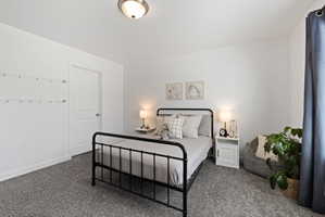 Bedroom with dark carpet