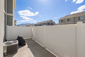 View of patio / terrace featuring a residential view and a mountain view