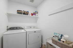 Laundry room featuring washer and dryer