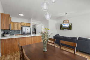 Dining space with light wood-style flooring