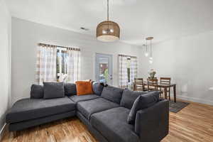 Living room with baseboards and light wood finished floors