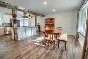 Dining room featuring ceiling fan, recessed lighting, dark wood-style floors, and beamed ceiling