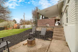 Fenced backyard with a patio area
