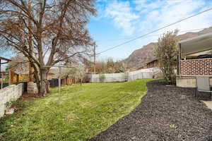 View of fenced backyard