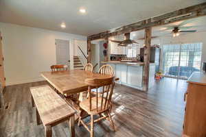 Dining room with a ceiling fan, recessed lighting, and dark wood-style floors