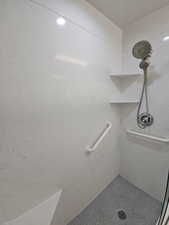 Primary Bathroom featuring a marble finish shower