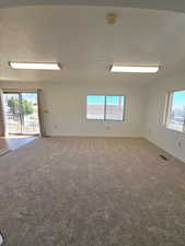 Living room with access to deck through sliding glass doors
