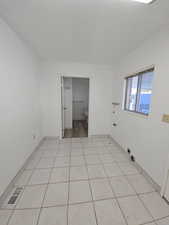 Laundry room featuring light tile patterned floors