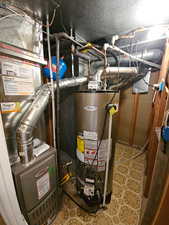 Utilities featuring gas water heater and heating unit
