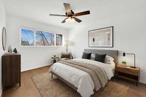 Bedroom with ceiling fan and light wood finished floors