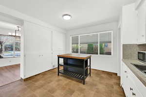 Dining space with stone finish flooring