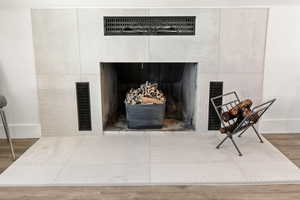 Detailed view of baseboards and wood finished floors