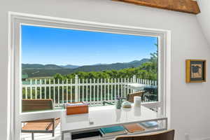 Balcony with a mountain view and outdoor dining space