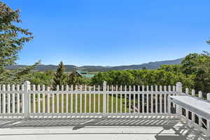Wooden terrace featuring a mountain view