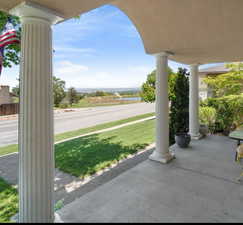 View of patio with a water view