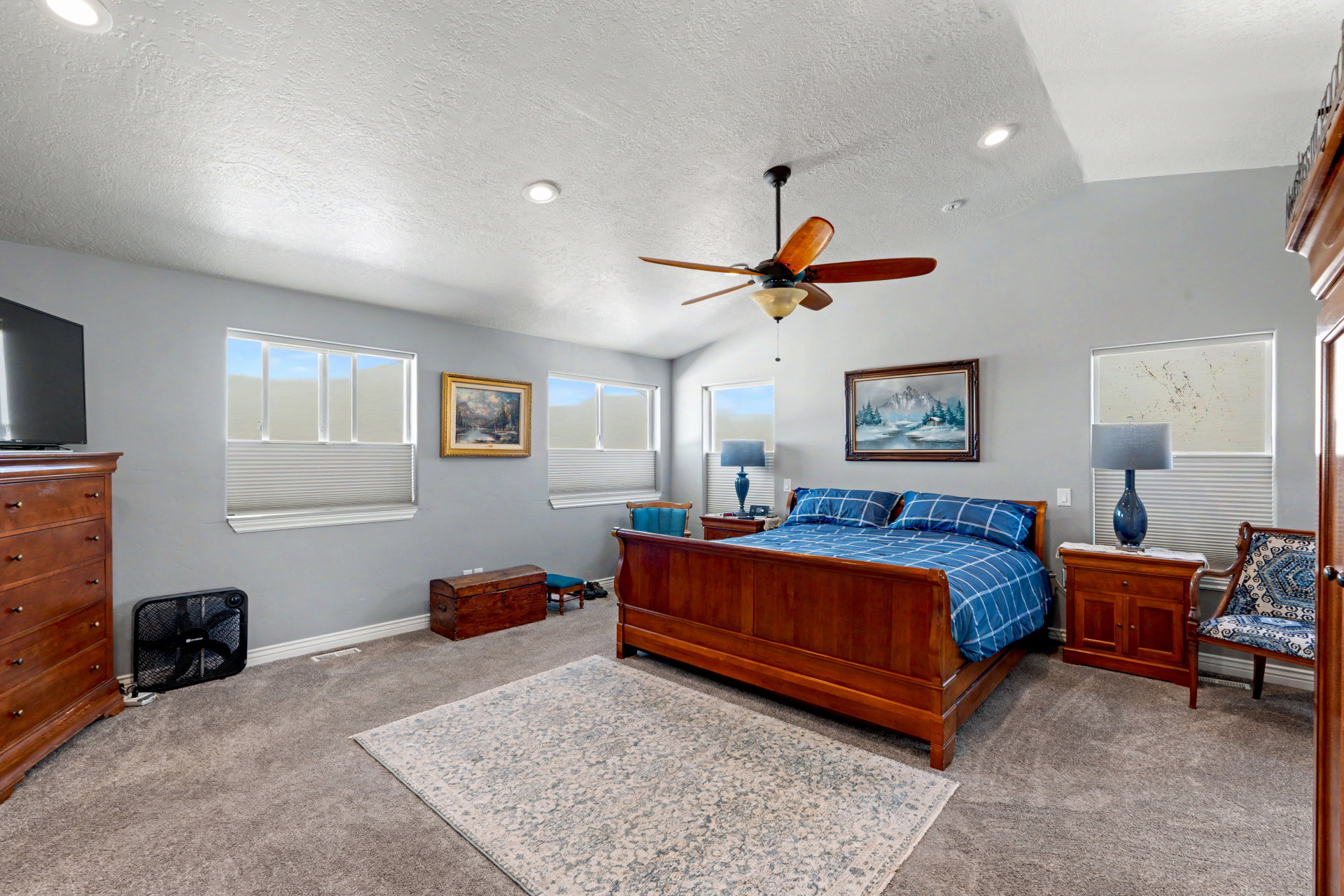 Massive Owners Bedroom featuring light carpet, ceiling fan, and recessed lighting