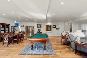 Game room featuring billiards, light wood-style flooring, and recessed lighting