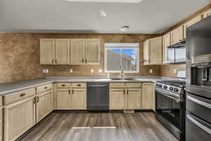 Kitchen with stainless steel appliances, light wood finish cabinetry. All appliances included!