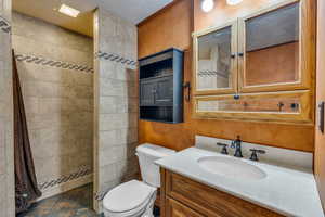 Full bathroom with vanity and walk in shower