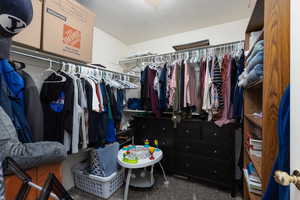 Walk in closet featuring carpet
