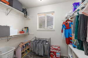 Walk in closet featuring carpet