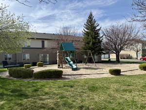 Communal playground featuring a yard