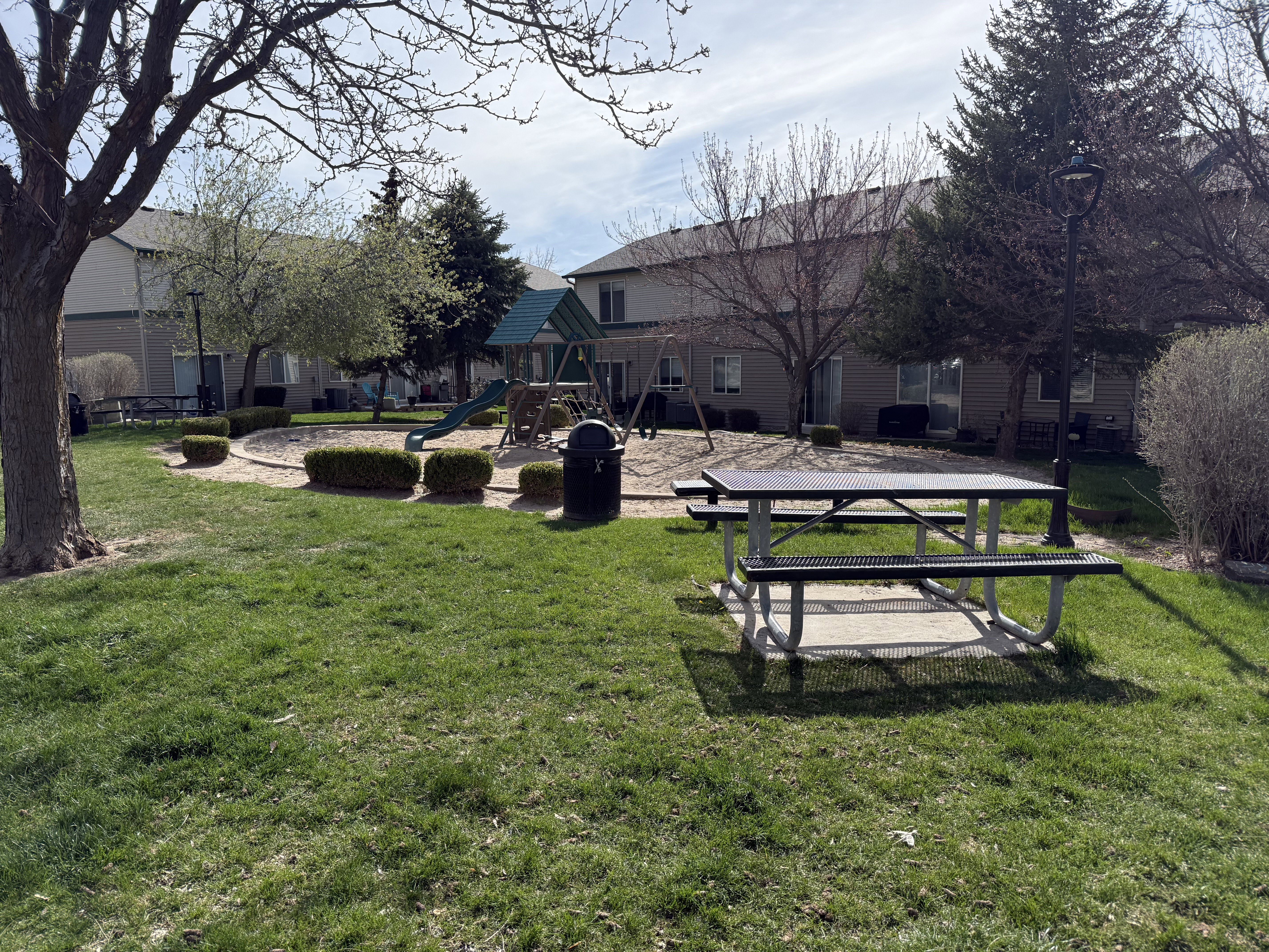 View of grassy yard featuring a patio