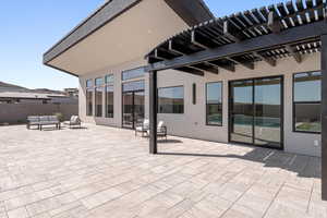 View of patio featuring a pergola and outdoor furniture