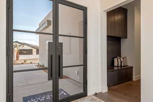 Doorway featuring wood finished floors and french doors