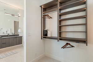 Walk in closet with a sink