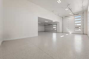 Garage featuring baseboards