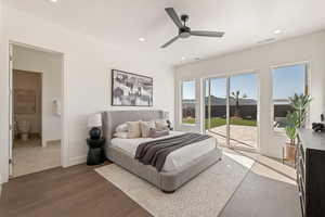 Bedroom featuring access to exterior, wood finished floors, a ceiling fan, recessed lighting, and a mountain view