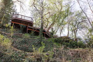 Back of house featuring a deck