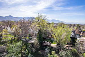 View of mountain backdrop featuring nearby suburban area