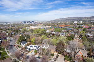 View of urban area with a mountain backdrop and nearby suburban area