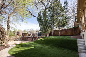 Fenced backyard featuring a wooden deck
