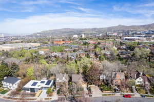 Aerial perspective of suburban area with a mountainous background