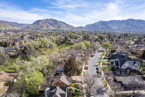 Aerial perspective of suburban area featuring a mountainous background