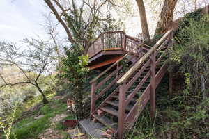 Wooden terrace featuring stairway