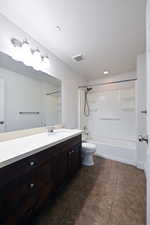 Bathroom with tub / shower combination, vanity, recessed lighting, and a textured ceiling