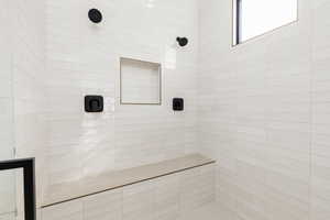 Full bathroom with tiled shower