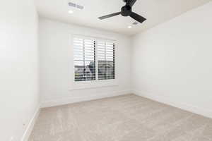 Unfurnished room featuring light colored carpet, ceiling fan, and recessed lighting