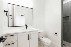 Bathroom with vanity and a shower stall