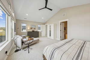 Bedroom with light colored carpet, lofted ceiling, ceiling fan, and recessed lighting